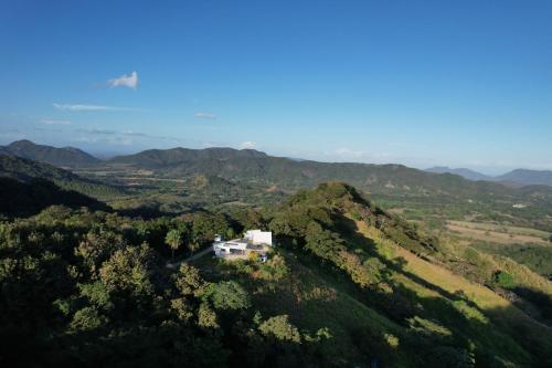 an aerial view of a house on a mountain at Blue Sky Lodge in Nicoya