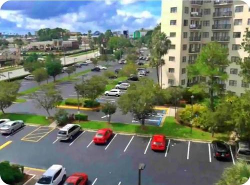 an aerial view of a parking lot with cars at Emerald Luxe Lakeview 6 min to EPIC Universe in Orlando