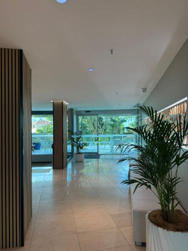 a hallway with plants in a building at Royal Palm Resort on the Beach in Gold Coast