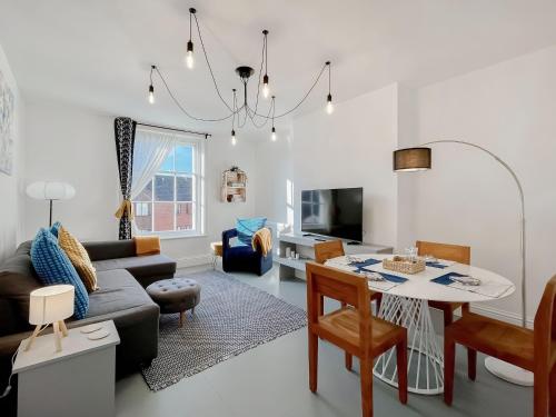 a living room with a couch and a table at Apartment Three - Uk48495 in Gloucester