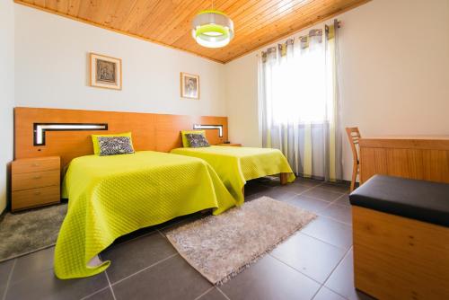 Ένα ή περισσότερα κρεβάτια σε δωμάτιο στο Casa da Vigia