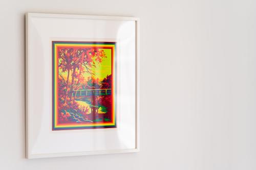 a framed picture of a painting on a wall at Flower Base HIMAWARI in Fukuoka