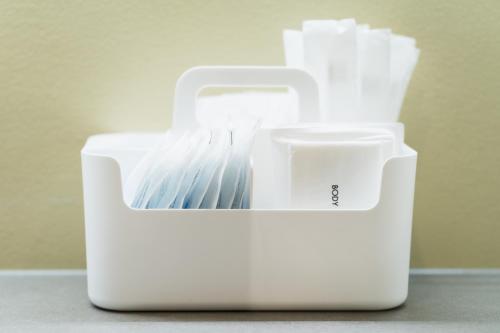 a white container filled with white tooth brushes at Flower Base HIMAWARI in Fukuoka