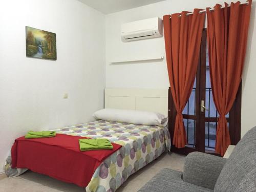 A bed or beds in a room at Estudio Las Huertas