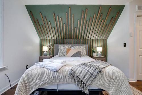 a bedroom with a large white bed with at The Mountain Muse - Music, Games, HotTub, Sleeps12, PetsOk in McGaheysville