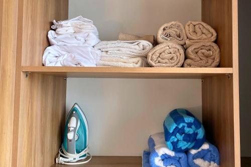a wooden shelf with towels and towels at Coco Zen Studio king size bed sea view near Coco Beach PDC in Playa del Carmen