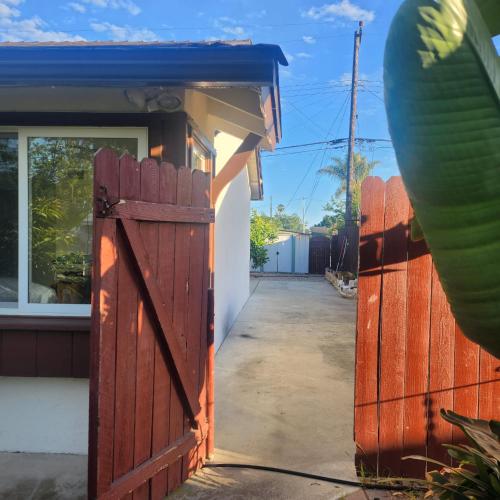 a wooden gate in front of a house at Cozy & Private Room in Goleta in Santa Barbara
