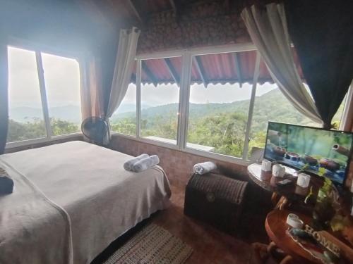 Ένα ή περισσότερα κρεβάτια σε δωμάτιο στο Mandalas Ecolodge Ecotourismo Altos Cerro Azul, Rain Forest Natural,Chagres National Park