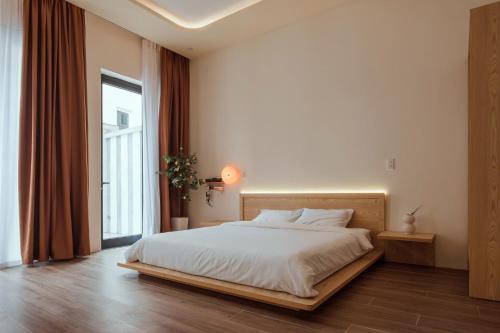 Postel nebo postele na pokoji v ubytování Homestay & Hotel Concept Maison