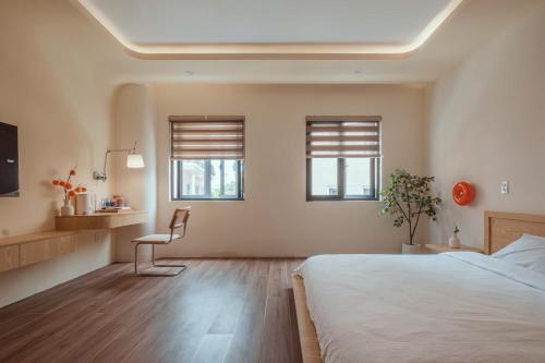 Postel nebo postele na pokoji v ubytování Homestay & Hotel Concept Maison