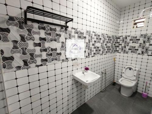 a bathroom with a sink and a toilet at Zyara Homestay Seremban in Seremban