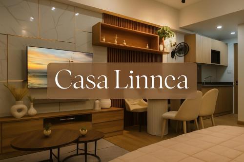 a living room with a casa limea sign in a kitchen at Casa Linnea - SMDC Cheer Residences in Marilao