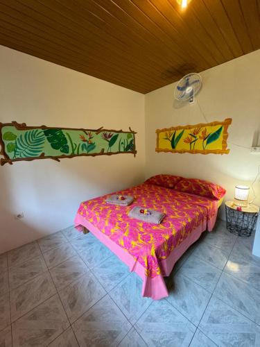a bedroom with a bed in a room at Mitiana Lodge Huahine in HUH