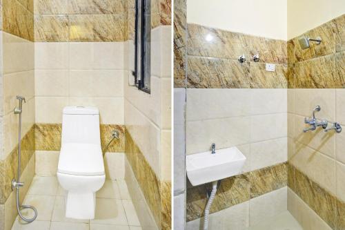 a bathroom with a toilet and a sink at Hotel O Neelkanth in Jaipur