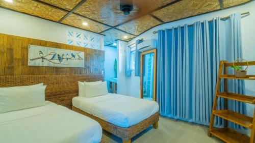 Ένα ή περισσότερα κρεβάτια σε δωμάτιο στο Pearl Bay Villas Private Resort