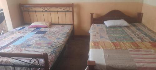 Postel nebo postele na pokoji v ubytování Don Bosco Home Stay