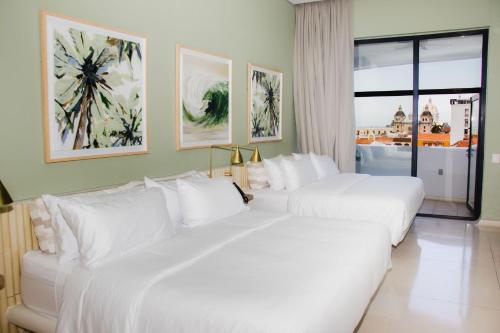 Ένα ή περισσότερα κρεβάτια σε δωμάτιο στο Terrazas Hotel Boutique