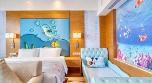 a hotel room with a bed and a large painting at Xiangsheng Century Hotel Zhuji in Shaoxing