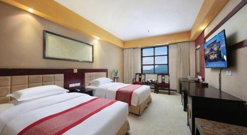 TV a/nebo společenská místnost v ubytování Dengfeng Chanwu Hotel
