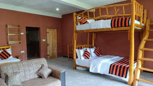 a living room with two bunk beds and a couch at Forest Rawana homestay Ella in Ella