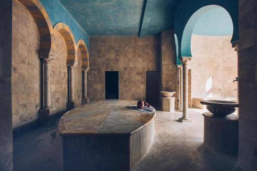 a large room with a table and a sink at Iberostar Selection Kantaoui Bay in Port El Kantaoui