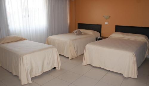 Katil atau katil-katil dalam bilik di Hotel Miraflores Villahermosa