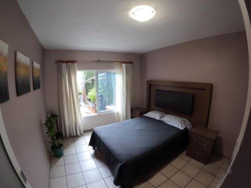 Postel nebo postele na pokoji v ubytování Casa León