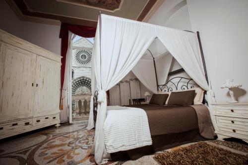 a bedroom with a bed with a canopy at Residenza Bendinelli-Sauli in Genoa
