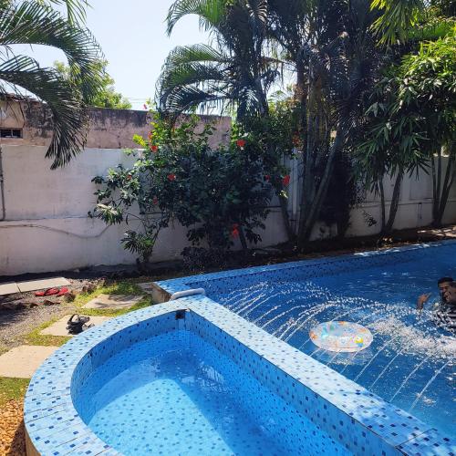a swimming pool in a yard with a swimming pool at Vanam Pool Stay in Pondicherry