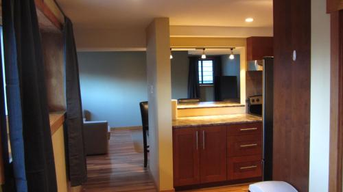 a kitchen with a sink and a refrigerator at Schaefer's Den in Jasper