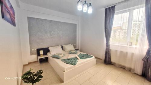 Postel nebo postele na pokoji v ubytování Ariana Luxury Apartament - Eforie Nord