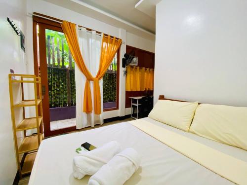 Voodi või voodid majutusasutuse Sudla Siargao Hostel toas