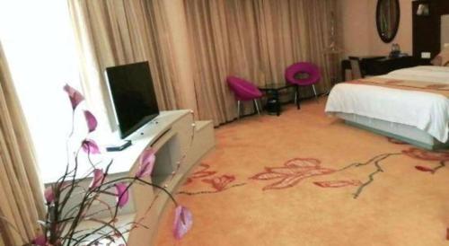 TV a/nebo společenská místnost v ubytování Wanxiang Hotel