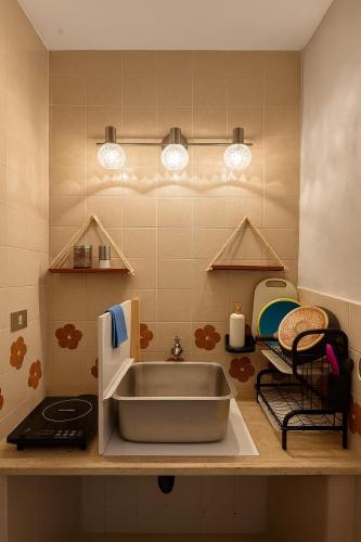 a kitchen counter with a sink in a kitchen at Burgos Studio in Cancún