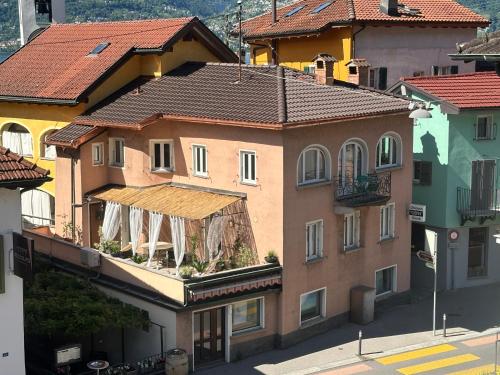 a group of buildings on a city street at Casa Papavero in Gambarogno