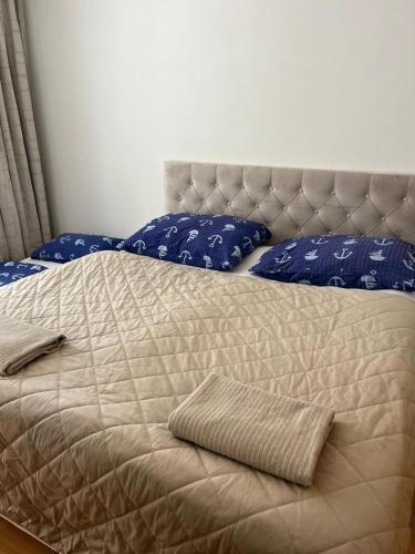 a bed with two pillows on top of it at KEY Accommodation Brno in Brno