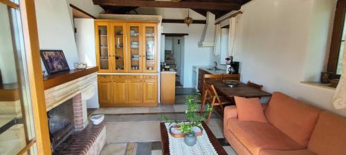 a living room with a couch and a table at koule Tasoula in Monemvasia