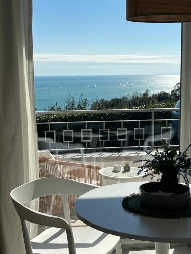 a view of a balcony with a table and chairs at IL MARE BLU in Lerici