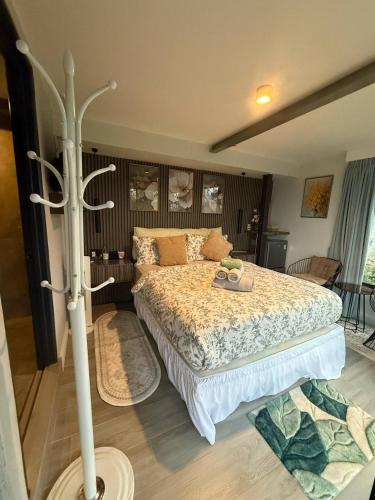 a bedroom with a large bed with at Green Therapy Cottage in Ranau