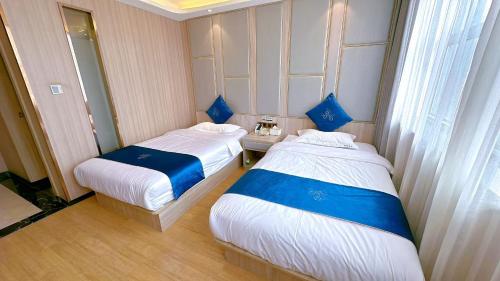 Postel nebo postele na pokoji v ubytování Lida Hotel