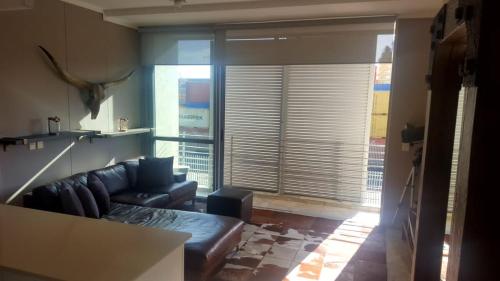 Et opholdsområde på Apartment near V&A Waterfront & Convention Centre