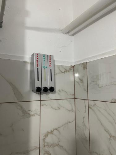 a bathroom with two toothbrushes on the wall at Chambres Élysées in Athens