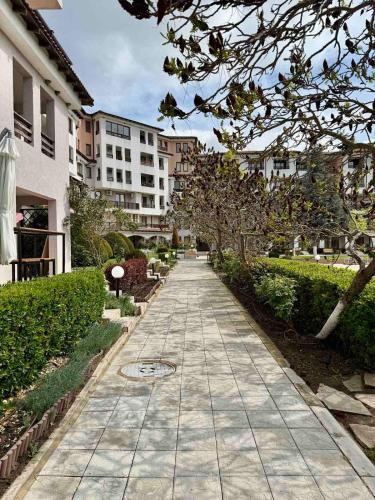 a sidewalk in a city with buildings in the background at Harmony Hills Osteon Studio apartment in Rogachevo