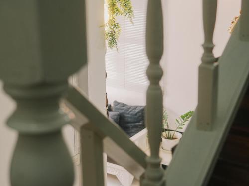 a stairway with potted plants in a room at Boxsoon Nimman 2 # 4beds 3baths in Chiang Mai