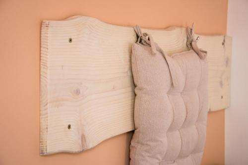 a pair of white gloves hanging on a wall at Przystanek Berdo in Zawóz