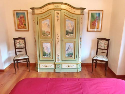 a largeoire in a room with two chairs at Ciasa Marian 10 minutes from Cortina with free parking! in Borca di Cadore