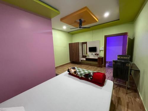 Postel nebo postele na pokoji v ubytování Maa Sumthira Lodge