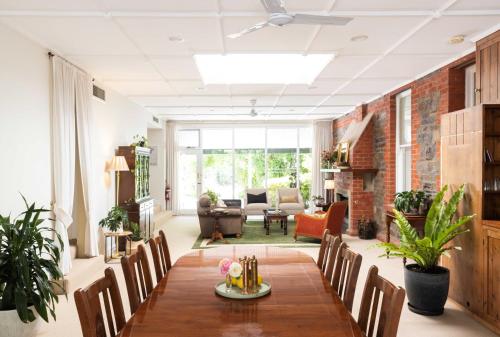a living room with a table and chairs at The Lodge at Seppeltsfield in Marananga