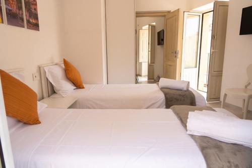 Una cama o camas en una habitación de Siclea