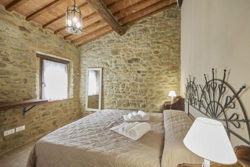 Postel nebo postele na pokoji v ubytování Villa L'Antico Mulino